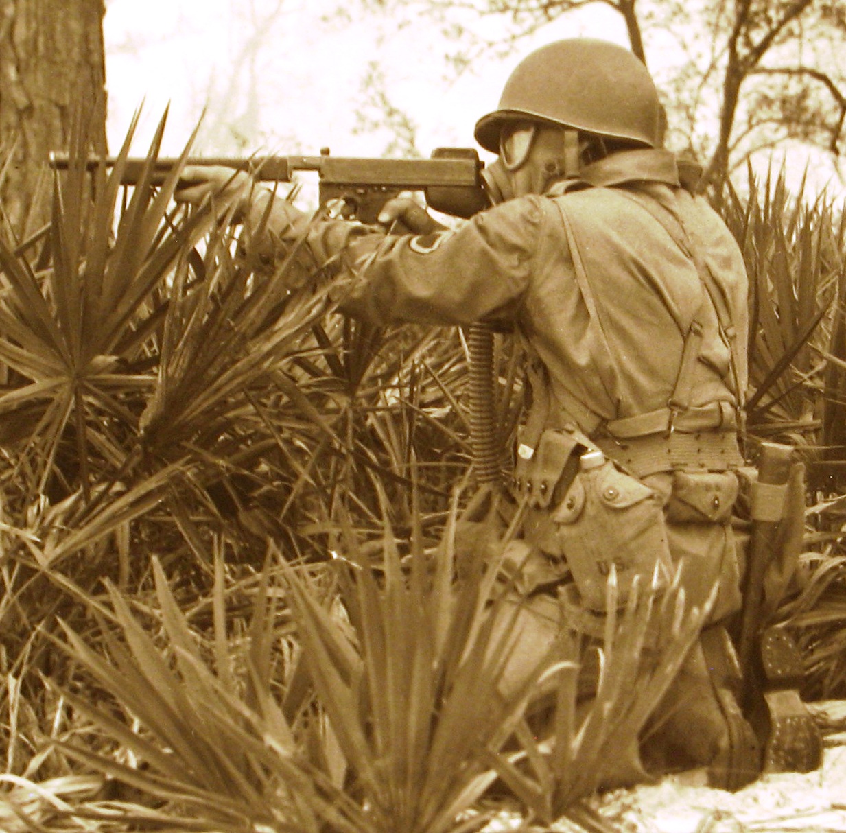 Camp Gordon Johnston soldier kneeling with rifle